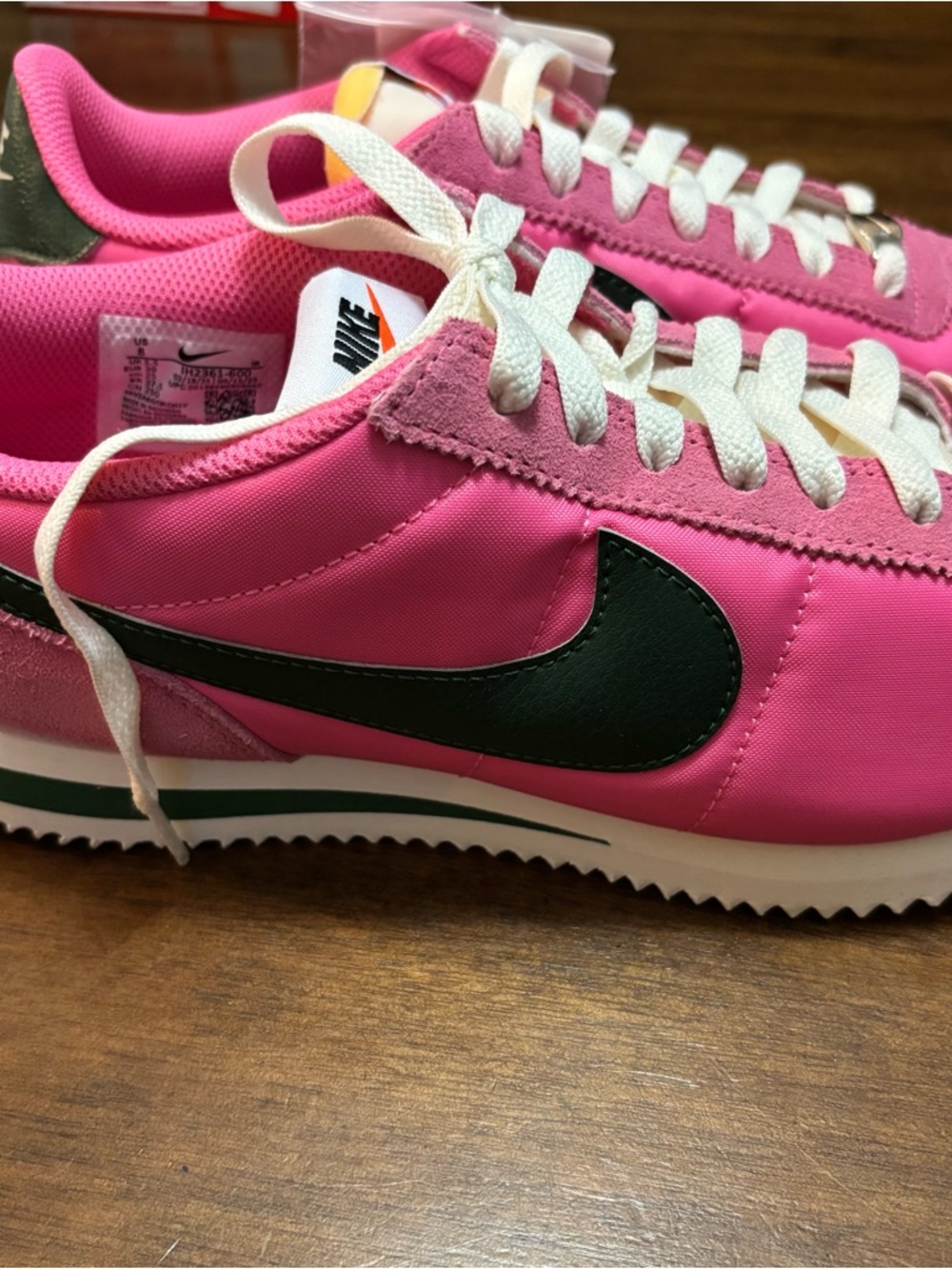 Nike Women’s Pink Sneakers with Black Swoosh